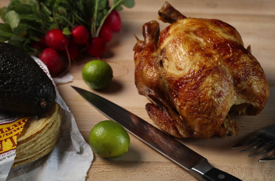 A supermarket rotisserie chicken can yield enough meat to make two taco dinners.