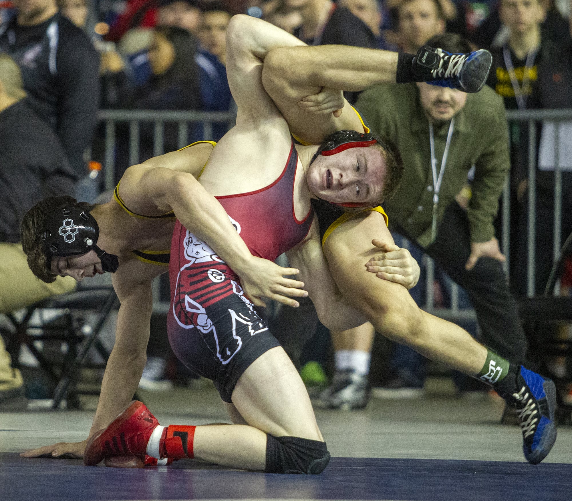 Camas' Tanner Craig grabs the legs of his Tahoma opponent, Steele Starren, during their 138-pound semifinals match on Saturday, Feb. 16, 2019, at the Mat Classic XXXI Championships held in the Tacoma Dome. Craig defeated Starren 5-3 in overtime.