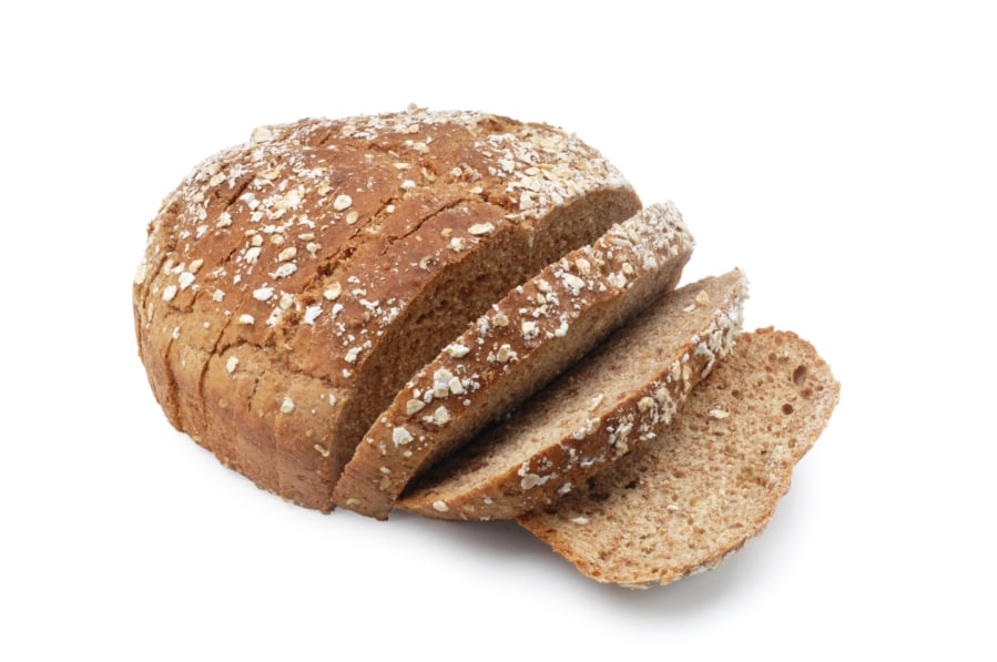 Wholemeal, brown, soda bread isolated on white.
