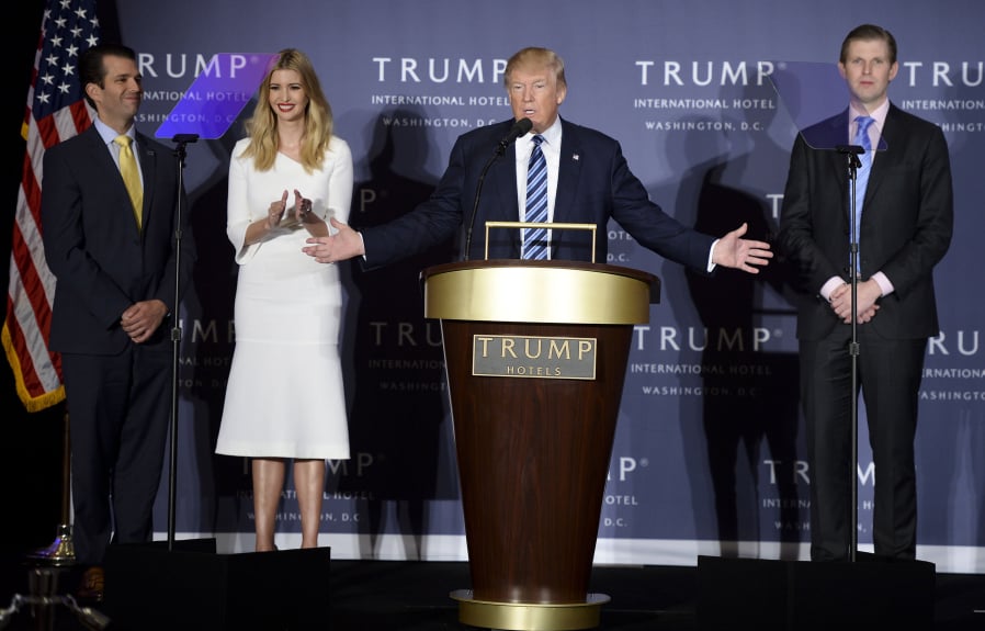 President Donald Trump speaks while surrounded by his children Donald Jr., from left, Ivanka and Eric Trump.