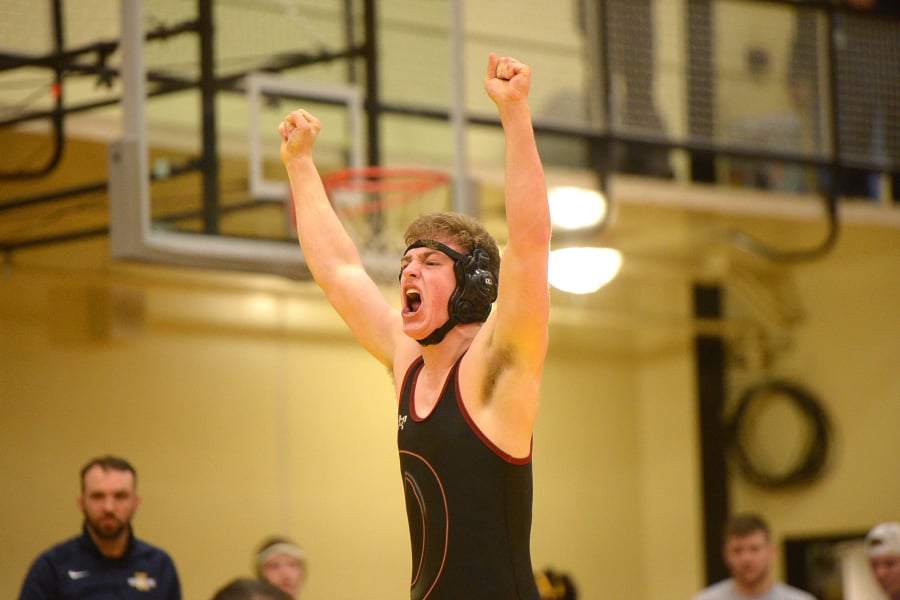 Prairie’s Nicholas Langer celebrates his victory over Kelso’s Blake Fowler in the 182-pound weight class.