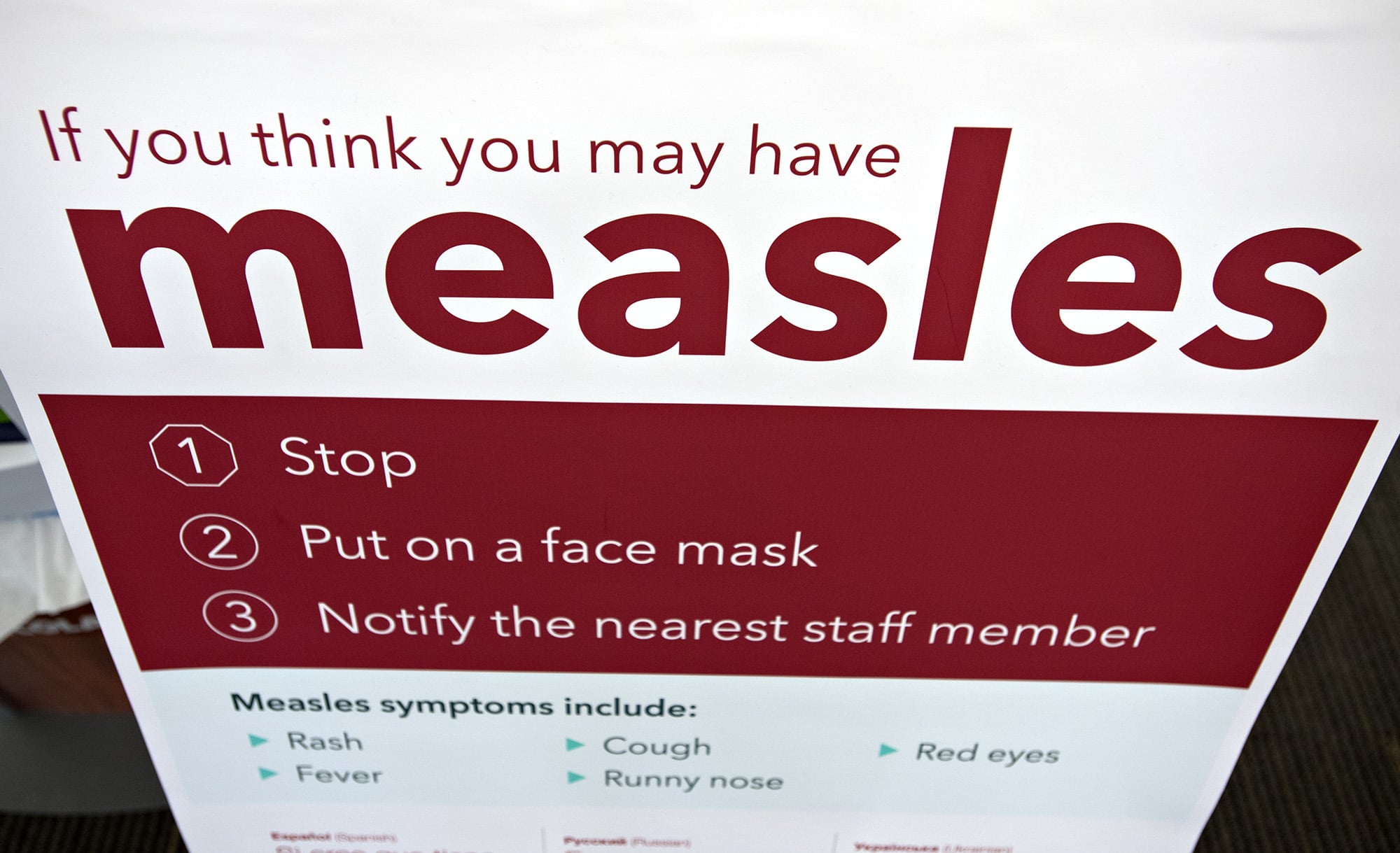 An informational sign about the measles is posted in the entrance of the Kaiser Permanente Cascade Park office Monday morning, Feb. 4, 2019.