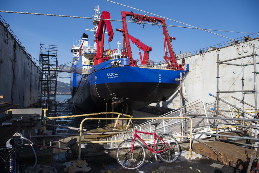 Repairs are done to a ship on the dry docks at Vigor on Swan Island in Portland.