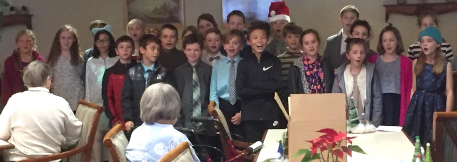 RIDGEFIELD: South Ridge Elementary School fourth graders perform for residents at Highgate Senior Living Center during a visit in December.