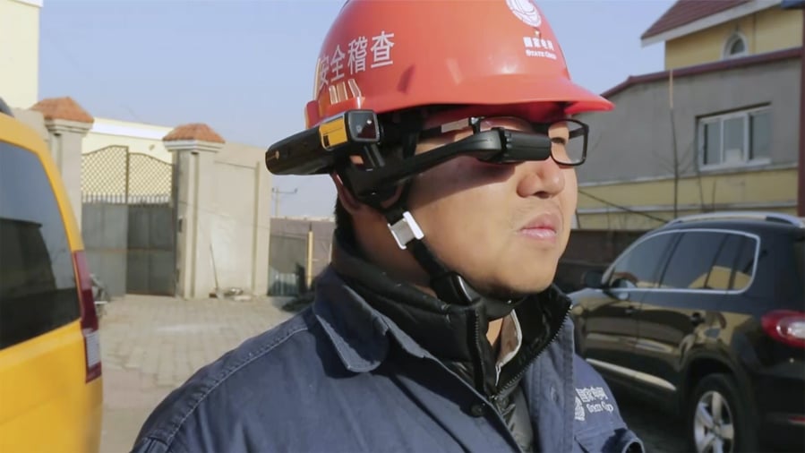 A State Grid worker looks at the screen on a RealWear HMT-1 headset.