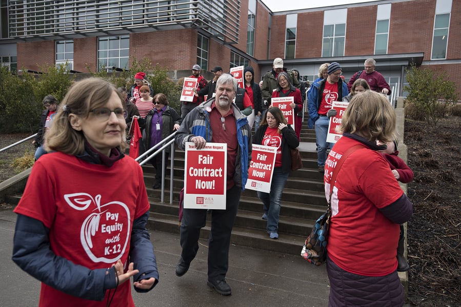 Clark College faculty and supporters prepare to make their way across campus during a rally for higher wages Feb. 13, 2019.