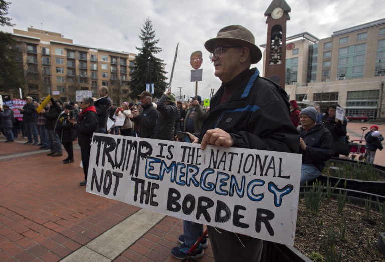 Vancouver resident Mo Hashemi joins a crowd of around 200 demonstrators at Esther Short Park on Monday afternoon, Feb. 18, 2019, as they show their opposition to the national emergency declared by President Donald Trump so a border wall with Mexico could be built.