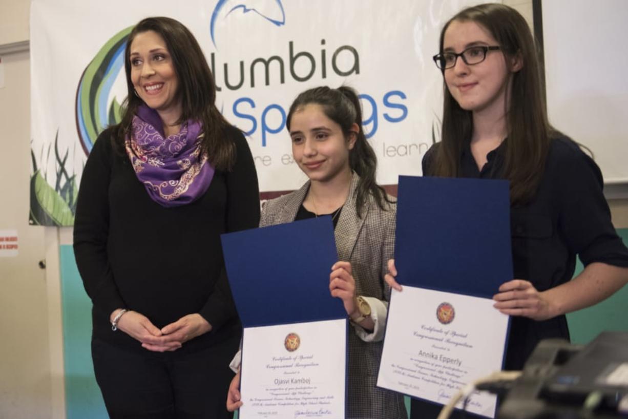U.S. Rep. Jaime Herrera Beutler, R-Battle Ground, from left, recognizes Ojasvi Kamboj and Annika Epperly as winners of the Congressional App Challenge at the Columbia Springs education center Wednesday.