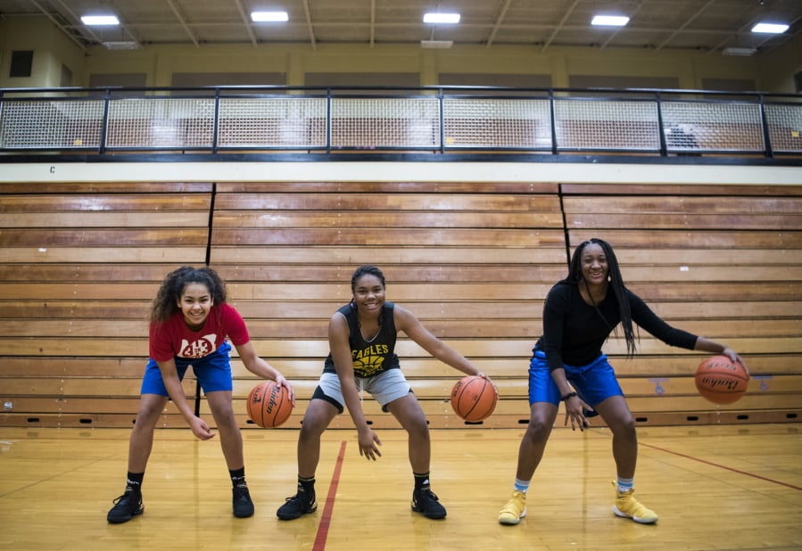 Hudson’s Bay sophomore Jaydia Martin, left, Hudson’s Bay freshman Aniyah Hampton, center, and sophomore Kamelai Powell, right, are pictured at practice on Feb. 21, 2019.