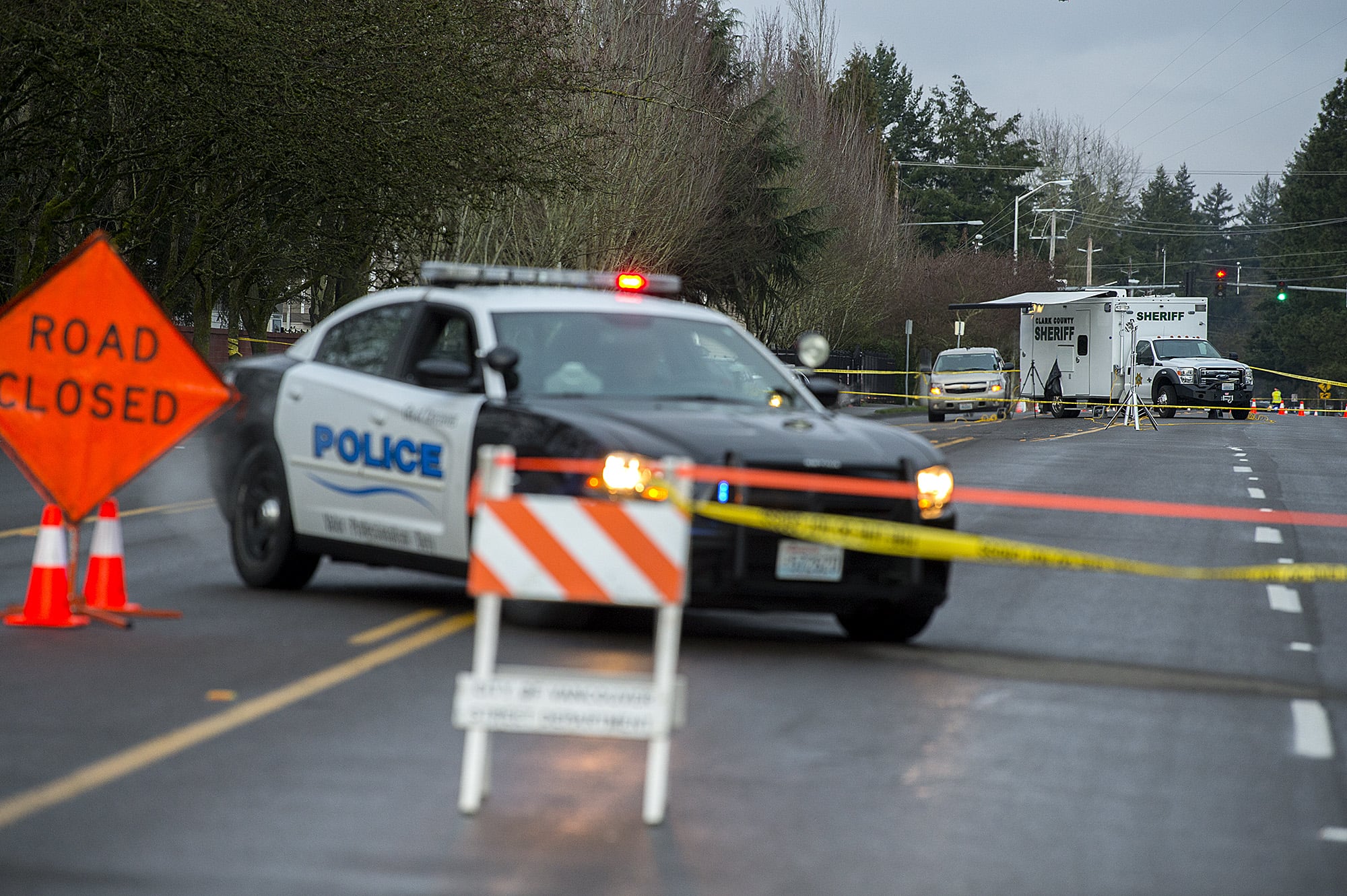Officials investigate the scene of an officer-involved shooting on Southeast 10th Street on Wednesday morning, Feb. 20, 2019.