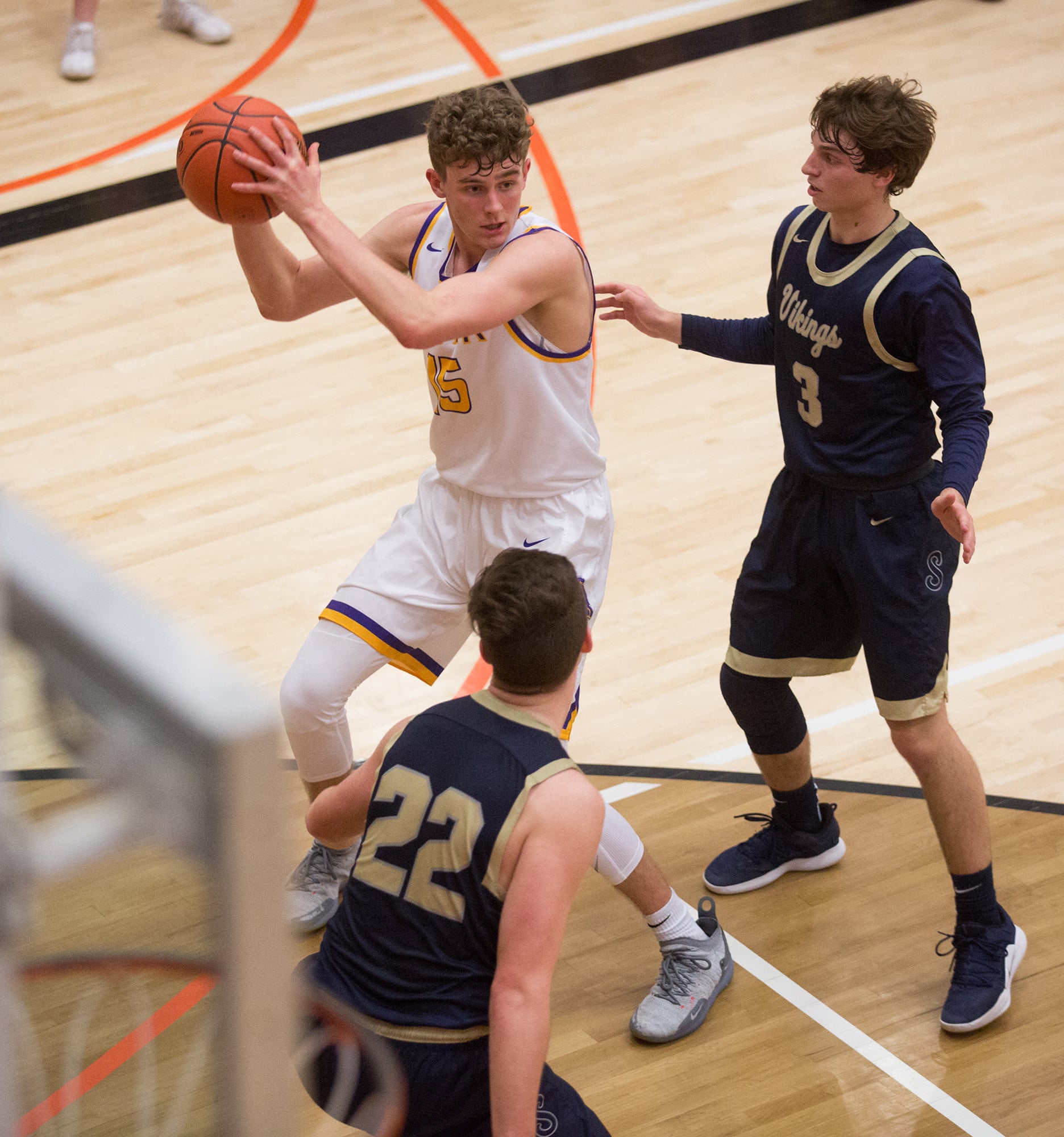 Columbia River's Evan Dirksen (15) looks to pass the ball while being defended by Selah's Calvin Herting (3) and Noah Pepper (22) during the second half of a 2A regional basketball game at Battle Ground High School, Saturday, Feb. 23, 2019. Selah defeated Columbia River 66-61.