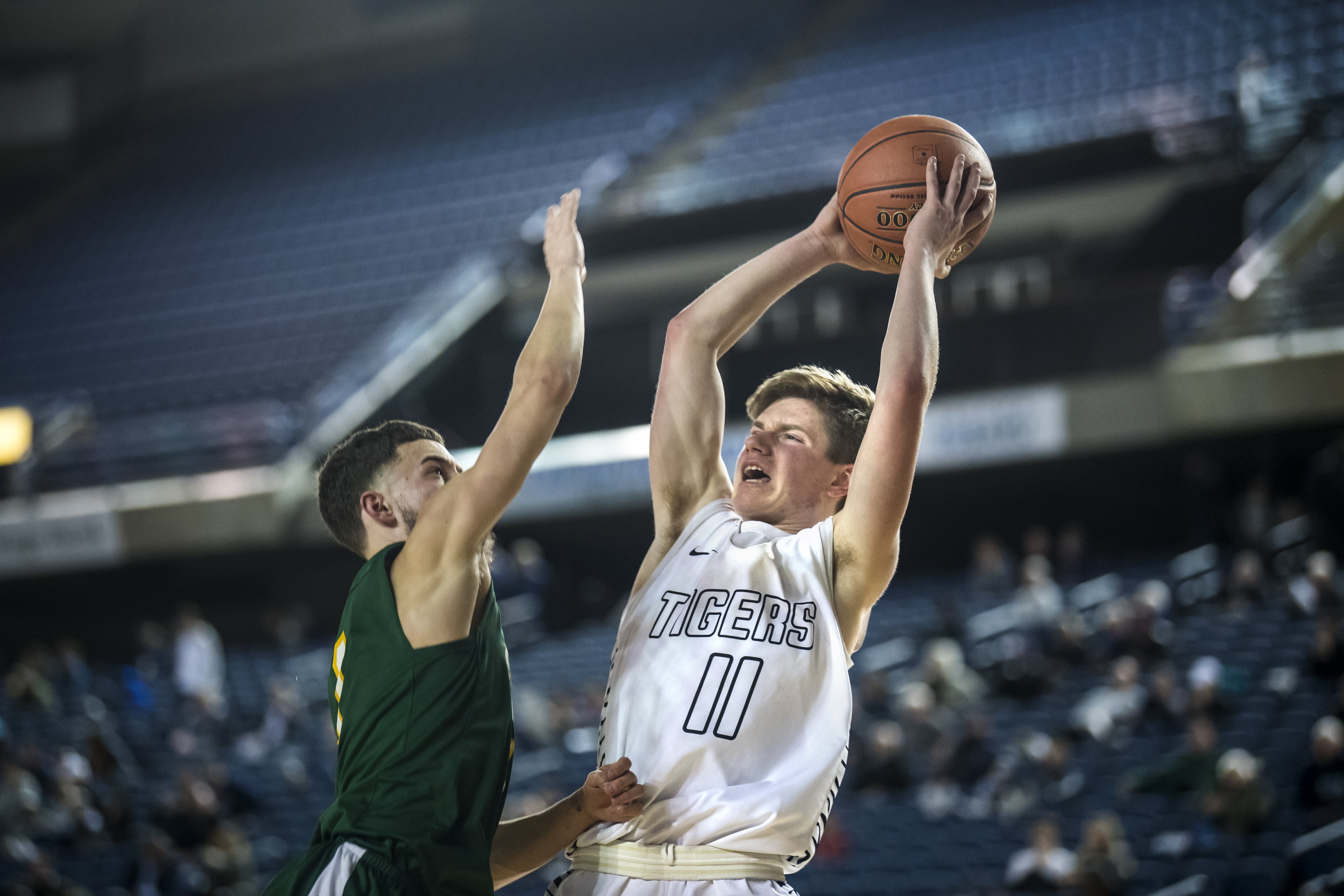 Battle Ground's Nathan Millspaugh is blocked by a Kentridge defender during the 4A Hardwood Classic at the Tacoma Dome on Wednesday, Feb. 27, 2019.