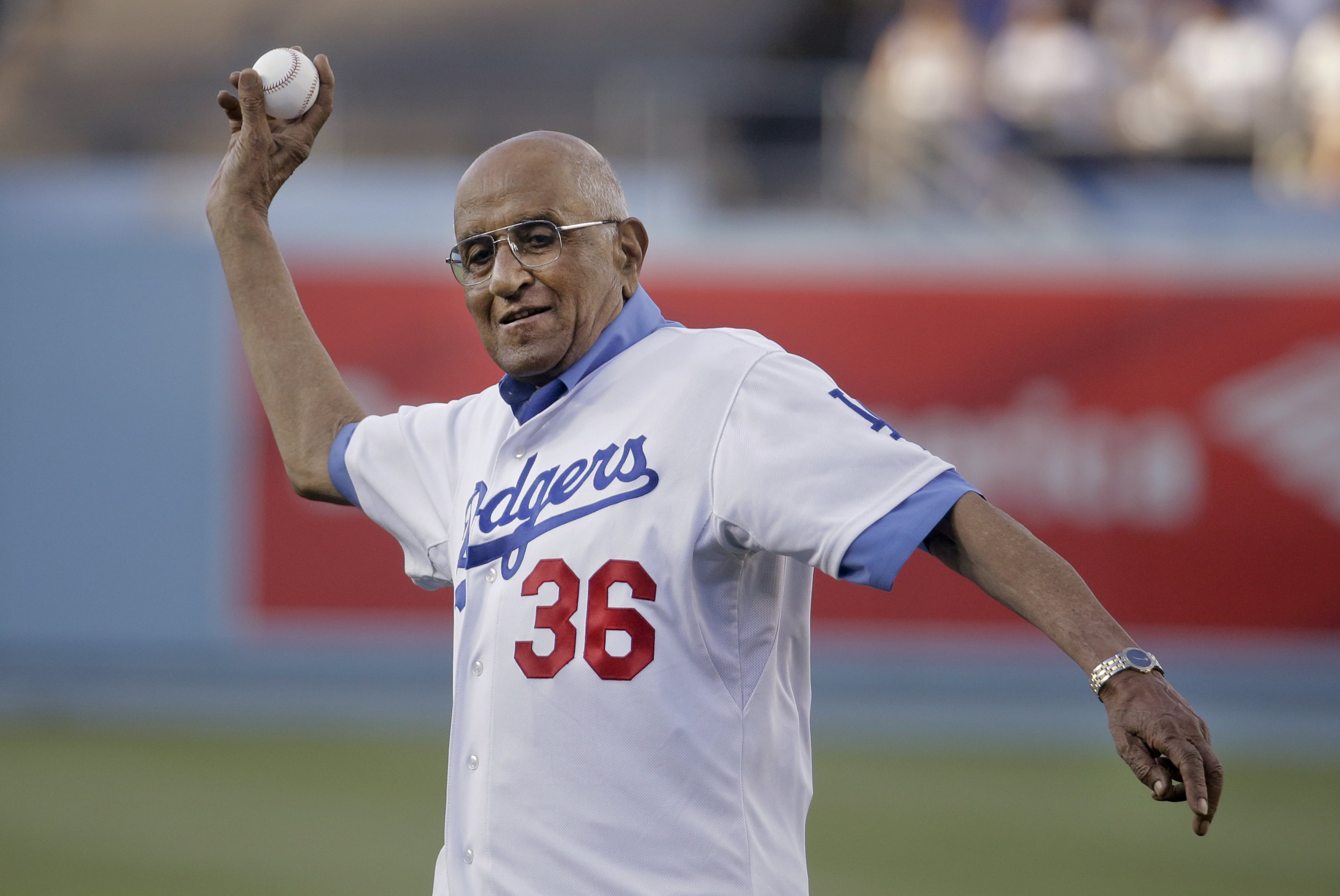 Former Los Angeles Dodgers pitcher Don Newcombe throws a ceremonial pitch before a game between the Los Angeles Dodgers and the Cleveland Indians in 2014. Newcombe died Tuesday, Feb. 19, 2019, after a lengthy illness. He was 92.
