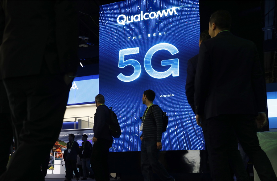 A sign advertises 5G at the Qualcomm booth at CES International in Las Vegas in January. A new technical standard for wireless networks, 5G promises faster speeds; less lag, or “latency,” when connecting to the network; and the ability to connect many devices to the internet without bogging it down.