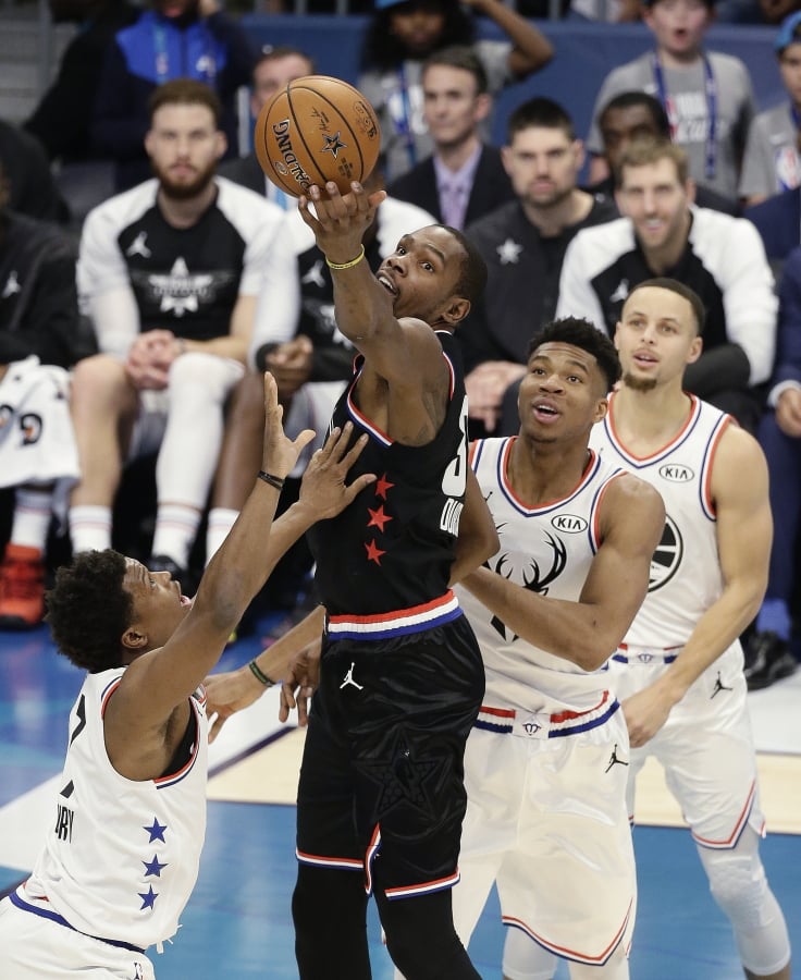 Team LeBron’s Kevin Durant, of the Golden State Warriors works against Team Giannis during the second half of an NBA All-Star basketball game, Sunday, Feb. 17, 2019, in Charlotte, N.C.