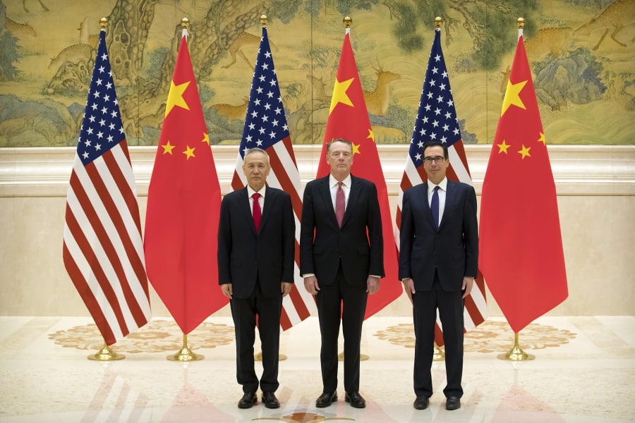 From left, Chinese Vice Premier and lead trade negotiator Liu He, U.S. Trade Representative Robert Lighthizer, and U.S. Treasury Secretary Steven Mnuchin pose for a photo before the opening session of trade negotiations at the Diaoyutai State Guesthouse in Beijing, Thursday, Feb. 14, 2019.