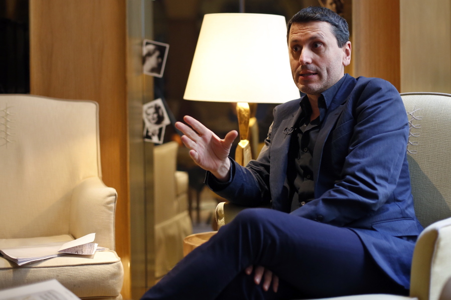 French writer Frederic Martel gestures during an interview with Associated Press, in Paris, Friday, Feb. 15, 2019. In the explosive book “In the Closet of the Vatican” author Frederic Martel describes a gay subculture at the Vatican and calls out the hypocrisy of Catholic bishops and cardinals who in public denounce homosexuality but in private lead double lives.