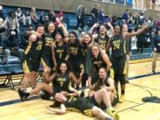 The Hudson's Bay girls basketball team poses in celebration after beating North Thurston 62-55 to earn the program's first state tournament berth since 2007.