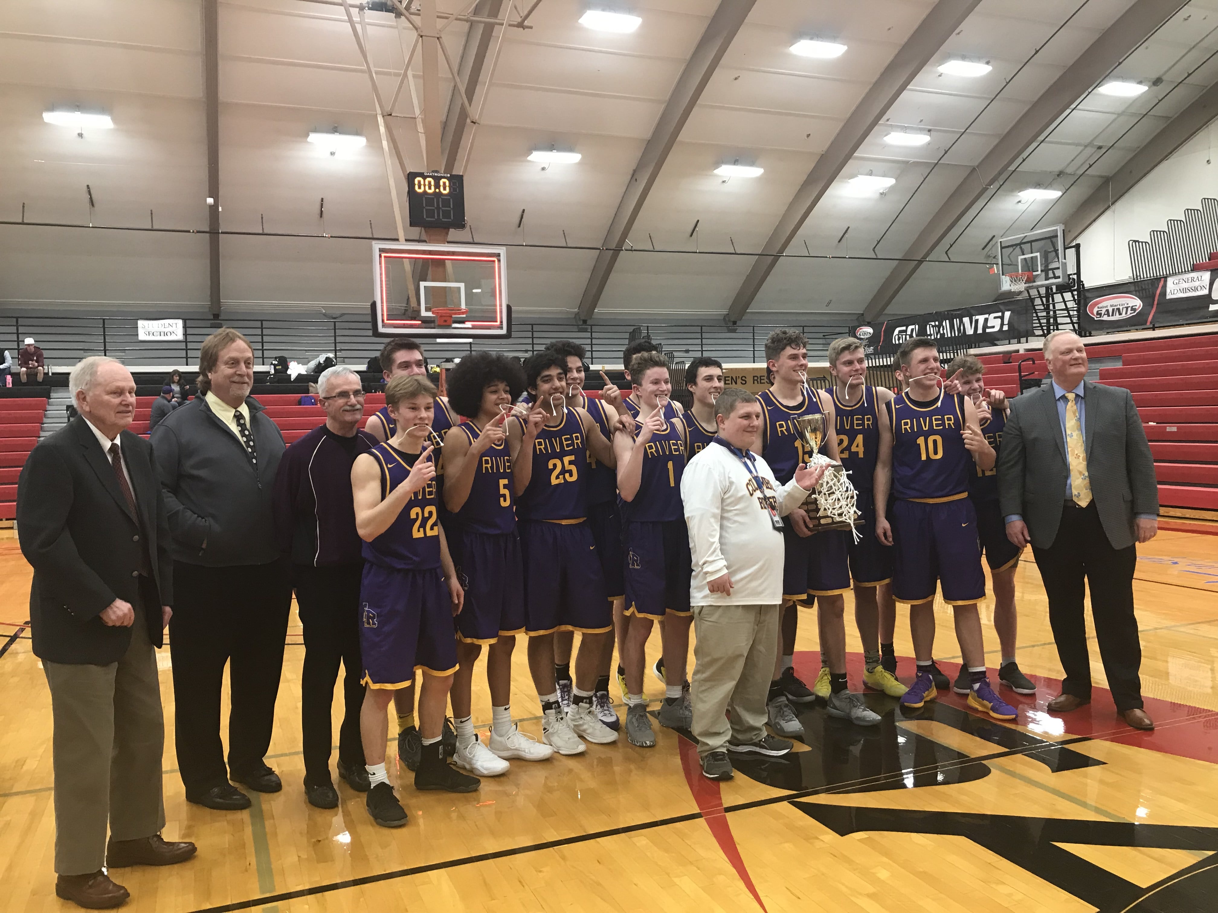 Columbia River celebrates its 75-40 2A district title win over Black Hills on Friday.