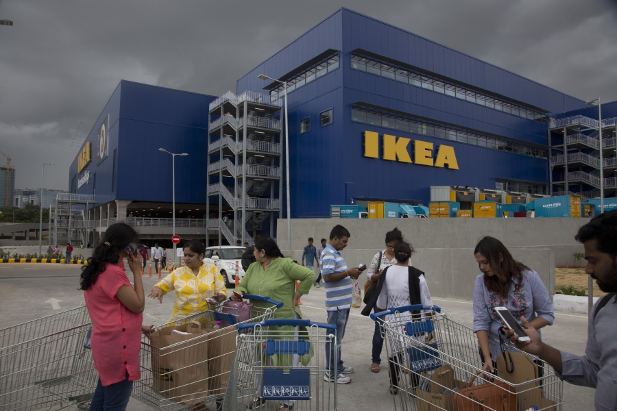 FILE- In this Aug. 9, 2018, file photo, Customers stand outside Ikea’s first store in India as it opened in Hyderabad, India. India is a test case for whether Ikea should keep shifting resources toward emerging economies, including Latin America and China, given the saturation of markets in Europe and the United States, and the possibility of another global recession. Six months after Ikea opened its first store in Hyderabad, the 400,000-square-foot cornucopia of furniture, linens, kitchenware and other goodies is drawing between 10,000 and 30,000 visitors per day.