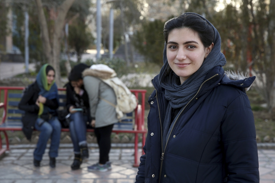 In this Tuesday, Jan. 29, 2019 photo, Kimia Zakeri, a 20-year-old graphic design student, is interviewed by The Associated Press about Iran’s 1979 Islamic Revolution, at a park in downtown Tehran, Iran. The “revolution babies” born after Iran’s the uprising 40 years ago that overthrew Shah Mohammad Reza Pahlavi and created the Islamic Republic represent a major force in the country. More than half of Iran’s 80 million people are under 35 and they must deal with the country’s economic struggles under re-imposed U.S. sanctions.