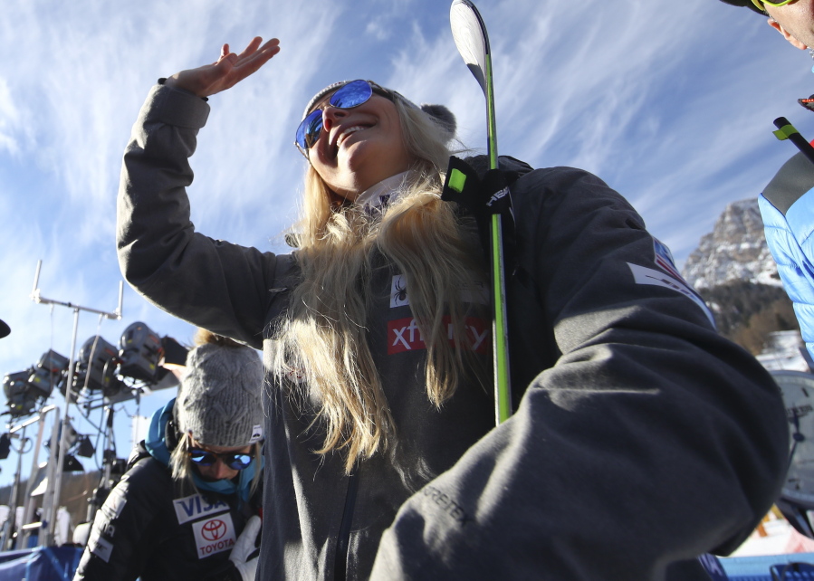 United States’ Lindsey Vonn waves as she stands in the finish area after completing an alpine ski, women’s World Cup super-G in Cortina D’Ampezzo, Italy, Sunday, Jan. 20, 2019.