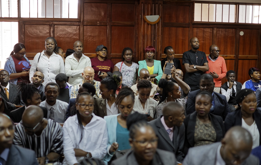 FILE-- In this file photo of Thursday Feb.22, 2018. Members of the public fill the courtroom as the High Court in Kenya begins hearing arguments in a case challenging parts of the penal code seen as targeting the lesbian, gay, bisexual and transgender communities, at the High Court in Nairobi, Kenya. Extortion, human rights violations ranging from assaults, physical, sexual and verbal, denial of access to state services, forceful evictions, harassment, being disowned by family members among other challenges, may become a thing of the past for the Kenyan gay community if a court rules on Friday Feb.