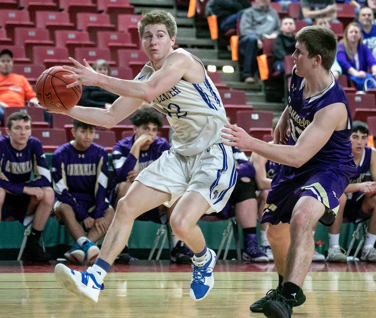 La Center's Avery Seter (12), grabs an errant pass before taking a shot against Connell's Austin Smith (13), during the WIAA 1A boys state tournament on Thursday, Feb. 28, 2019, at the Yakima Valley SunDome. The La Center Wildcats defeated the Connell Eagles 68-45.