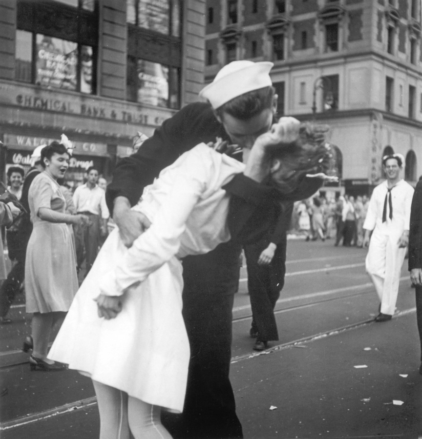 FILE - In this Aug. 14, 1945 file photo provided by the U.S. Navy, a sailor and a woman kiss in New York’s Times Square, as people celebrate the end of World War II. The ecstatic sailor shown kissing a woman in Times Square celebrating the end of World War II has died. George Mendonsa was 95. It was years after the photo was taken that Mendonsa and Greta Zimmer Friedman, a dental assistant in a nurse’s uniform, were confirmed to be the couple. (Victor Jorgensen/U.S.