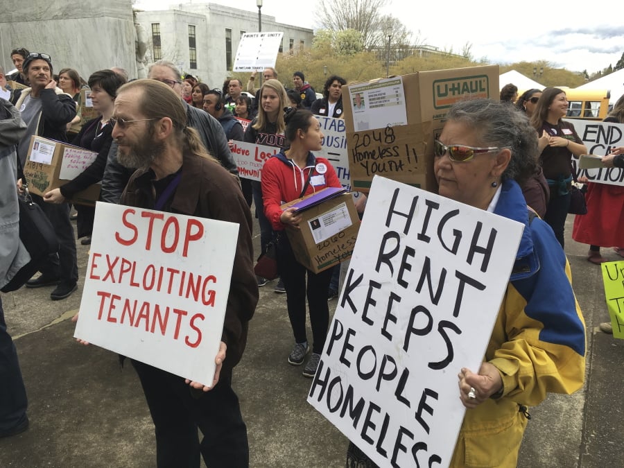 Supporters of a bill to ban most no-cause evictions of home renters demonstrate in April 2017 on the Capitol steps in Salem, Ore. Oregon is set to become the first state in the nation to impose mandatory rent control. The measure sailed through the Democratically controlled House on Tuesday. Landlords would only be allowed to raise rent a limited amount once per year under the bill, which previously passed the Senate.