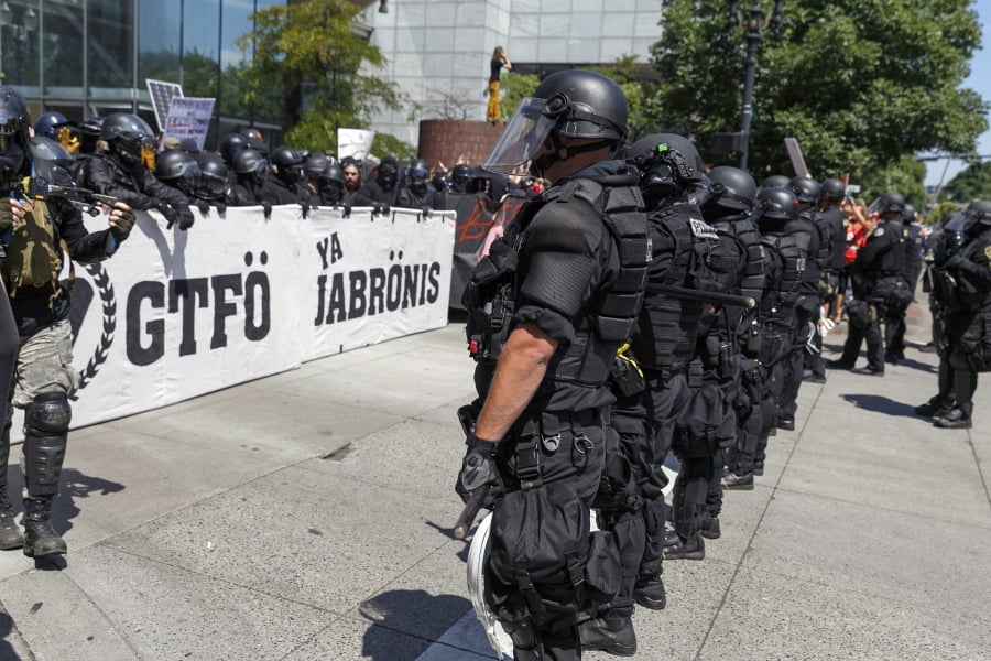 Portland police keep Patriot Prayer affiliates separate from antifa protesters during a rally on Aug. 4, 2018, in Portland.
