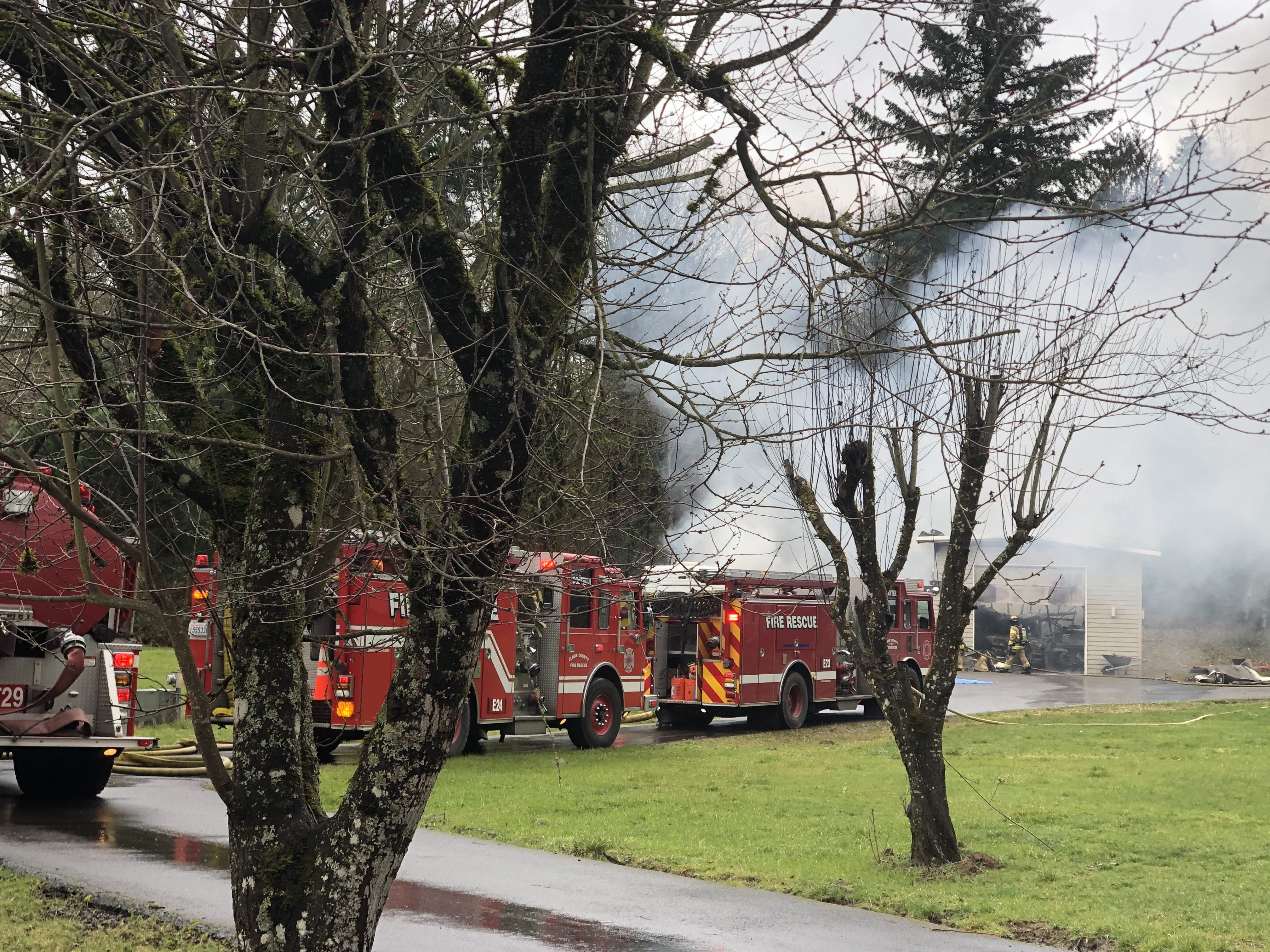 Multiple vehicles, including two classic trucks, were destroyed in this garage fire late Friday morning in Ridgefield. Clark County Fire & Rescue crew spent about a half-hour getting the fire under control.