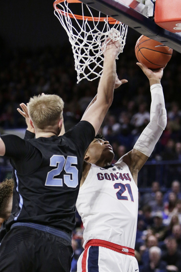 Gonzaga forward Rui Hachimura (21) shoots while defended by San Diego forward Yauhen Massalski (25) during the first half of an NCAA college basketball game in Spokane, Wash., Saturday, Feb. 2, 2019.