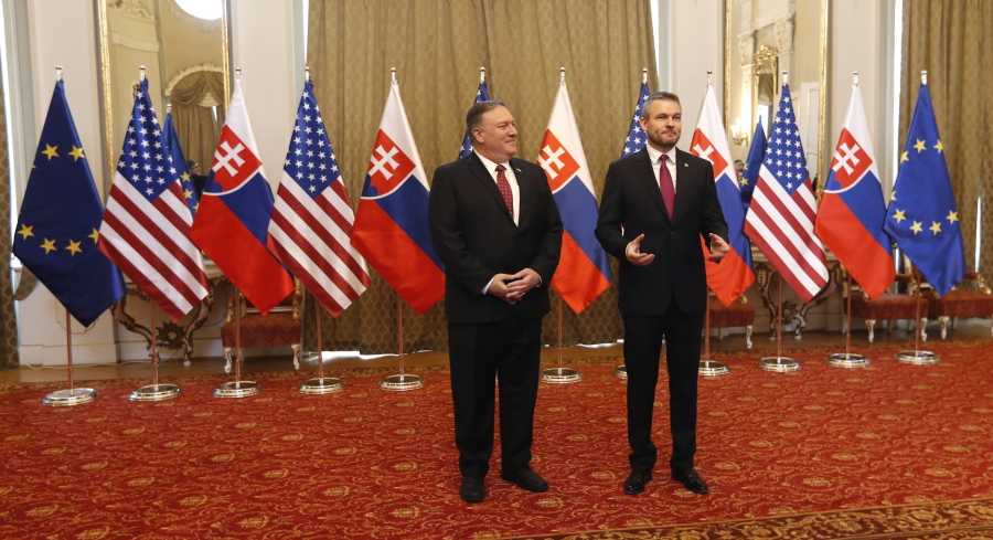 Slovakia’s Prime Minister Peter Pellegrini, right, welcomes US Secretary of State Mike Pompeo, during his visit to Bratislava, Slovakia, Tuesday, Feb. 12, 2019. Pompeo is in Slovakia on the second leg of a five-nation European tour that began in Hungary and will take him to Poland, Belgium and Iceland.