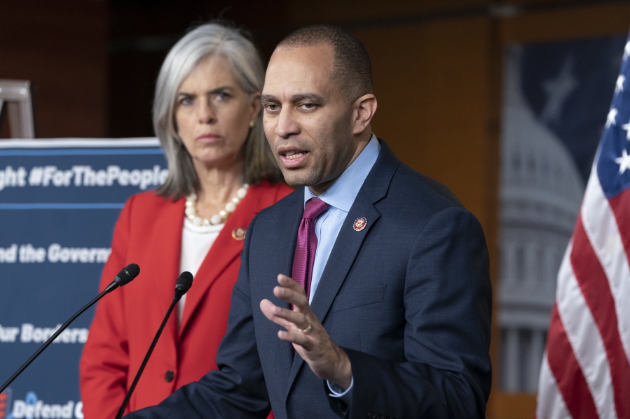 Rep. Hakeem Jeffries, D-N.Y., the Democratic Caucus chair, joined at left by Rep. Katherine M. Clark, D-Mass., left, Caucus vice chair, speaks with reporters at the Capitol in Washington, Wednesday, Feb. 13, 2019. Jeffries indicated that House Democrats would support the bipartisan border security compromise needed to avert another government shutdown. (AP Photo/J.