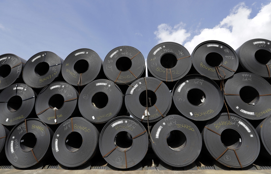 FILE - In this June 5, 2018, file photo, rolls of steel are shown in Baytown, Texas. Despite President Donald Trump’s tough talk on trade, his administration has granted hundreds of companies permission to import millions of tons of steel made in China, Japan and other countries without paying the hefty tariff he put in place to protect U.S. manufacturers and jobs, according to an Associated Press analysis.(AP Photo/David J.
