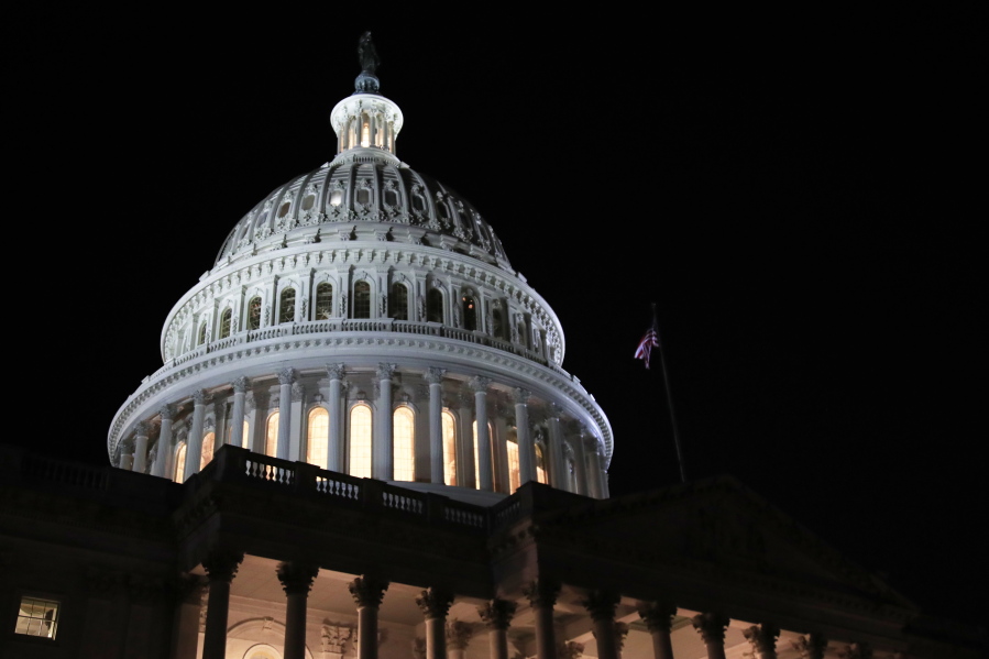 FILE- In this Feb. 5, 2019, file photo lights illuminate the U.S. Capitol dome in Washington. On Thursday, Feb. 21, the Labor Department reports on the number of people who applied for unemployment benefits last week.