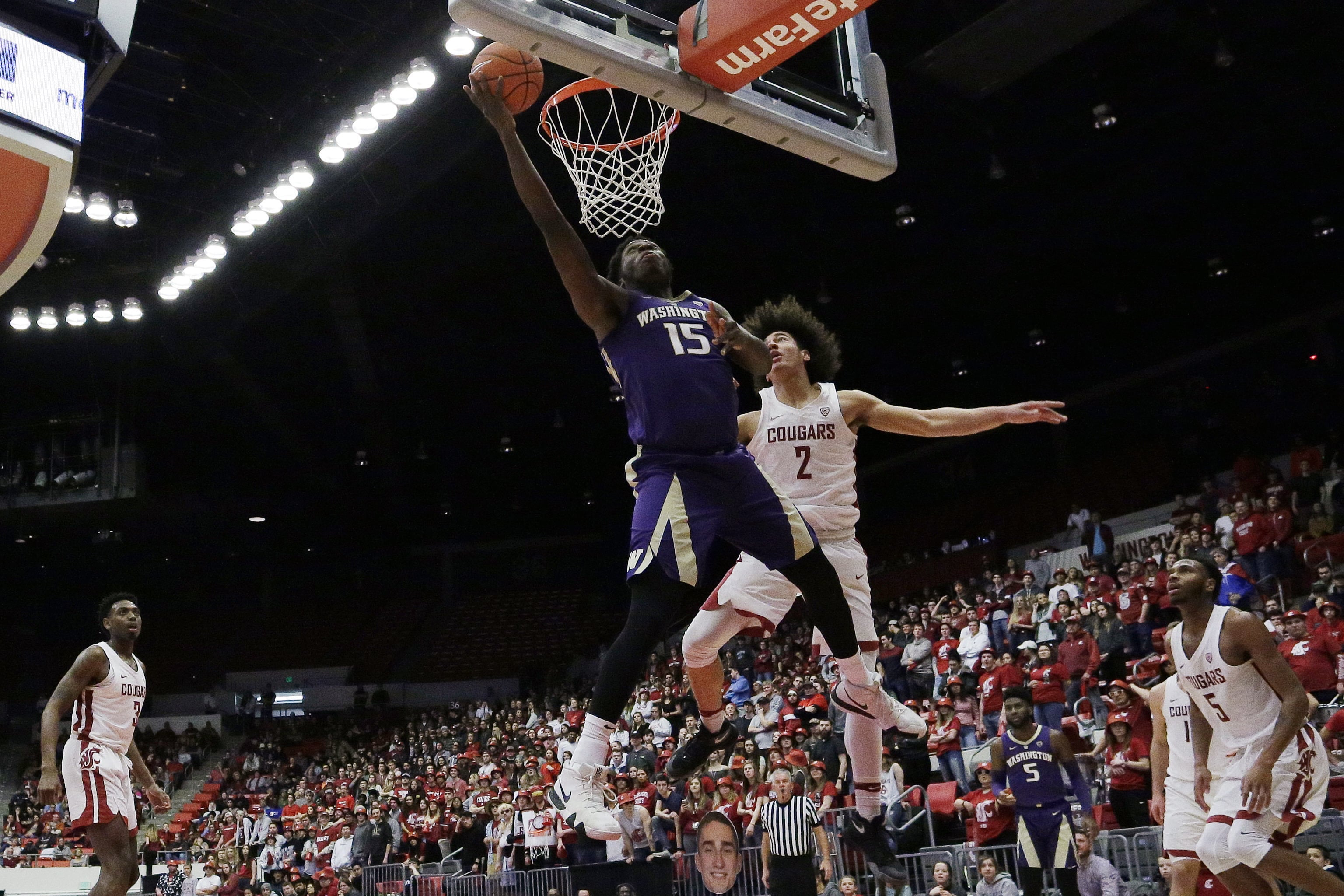Washington forward Noah Dickerson (15) shoots in front of Washington State forward CJ Elleby (2) during the second half of an NCAA college basketball game in Pullman, Wash., Saturday, Feb. 16, 2019.