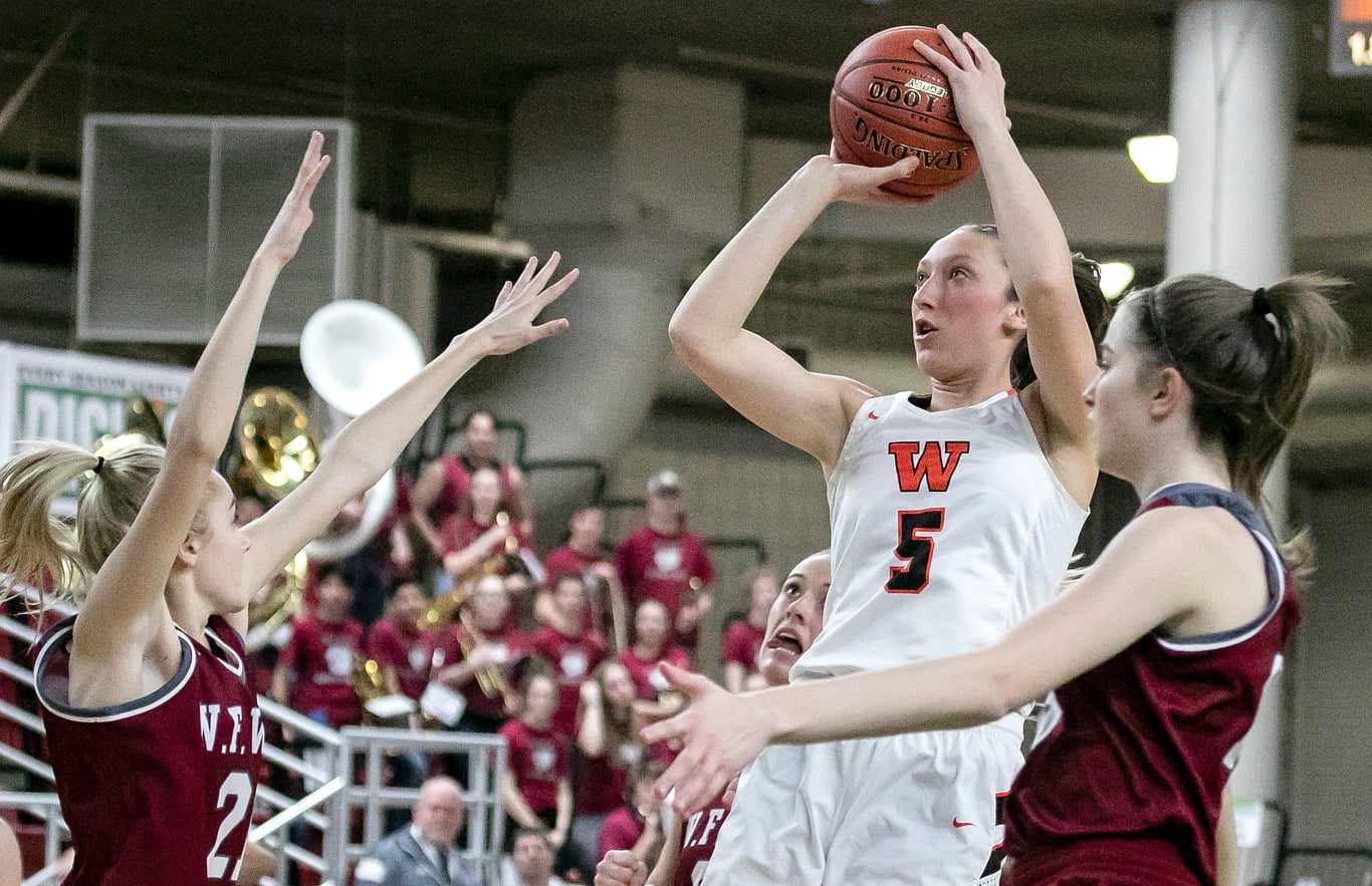Washougal's Beyonce Bea (5), shoots over W.F. West's Courtney Bennett (21), during the WIAA 2A girls state tournament on Thursday, Feb. 28, 2019, at the Yakima Valley SunDome.