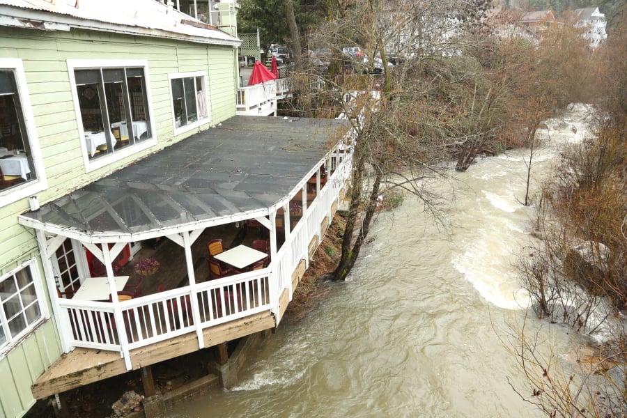 Water from Deer Creek begins to lap at the base of Lefty’s Grill in Nevada City, Calif., Wednesday, Feb. 13, 2019. The National Weather Service has prompted a flood advisory for local waterways and creeks.