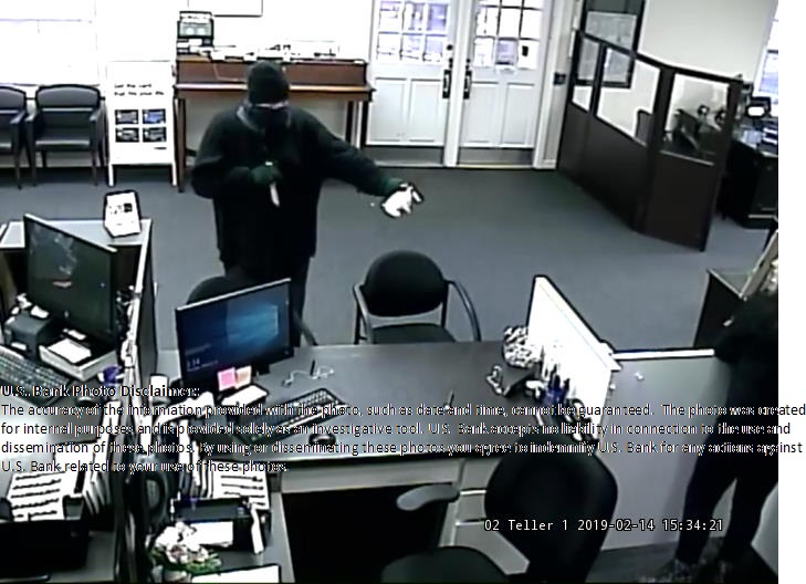 A man who robbed a U.S. Bank in Salmon Creek with a knife remains at large.