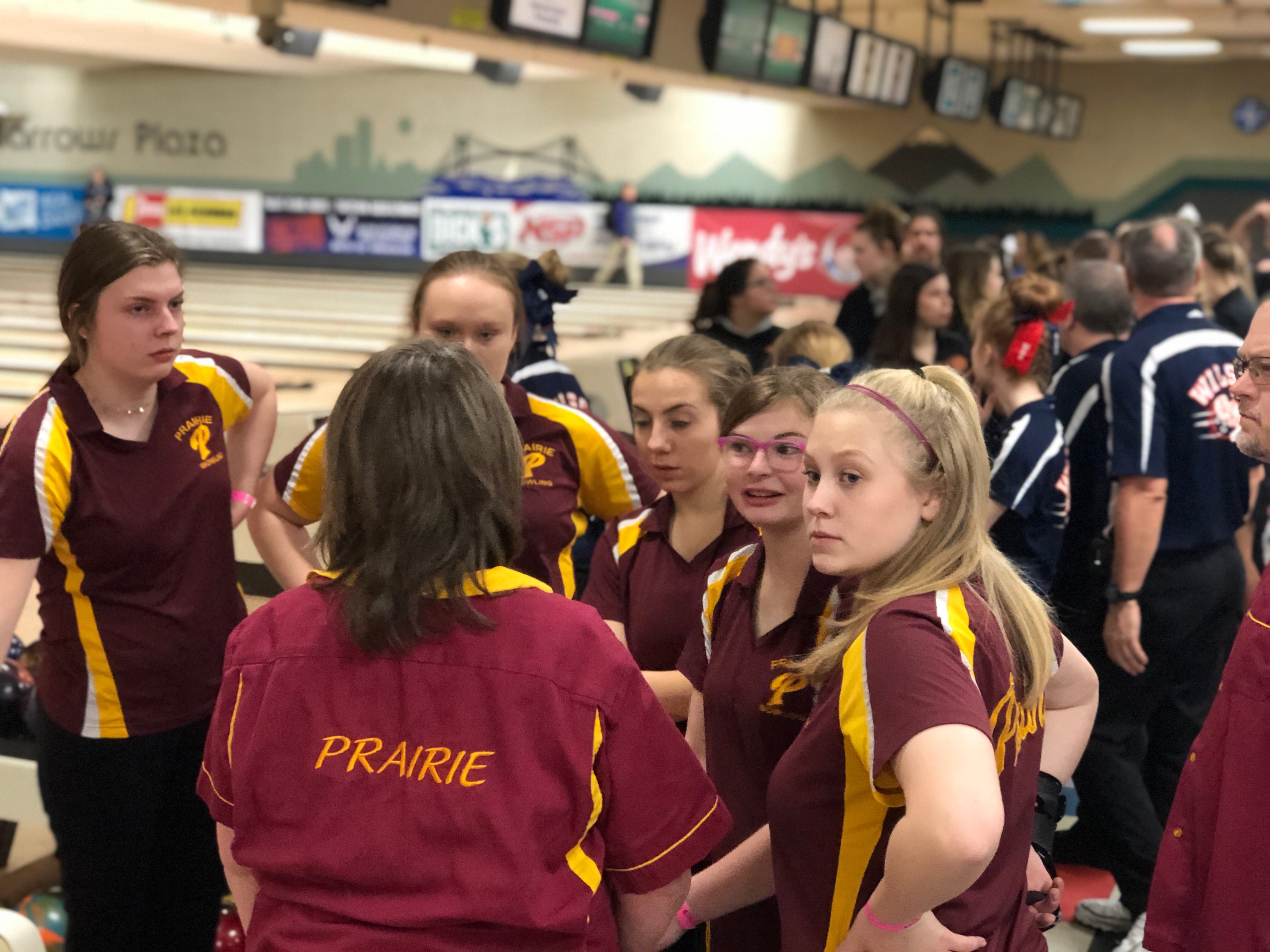 The Prairie girls bowling team gathers before the 3A state bowling team award ceremony, in which it placed second, on Friday at Narrows Plaza in University Place.