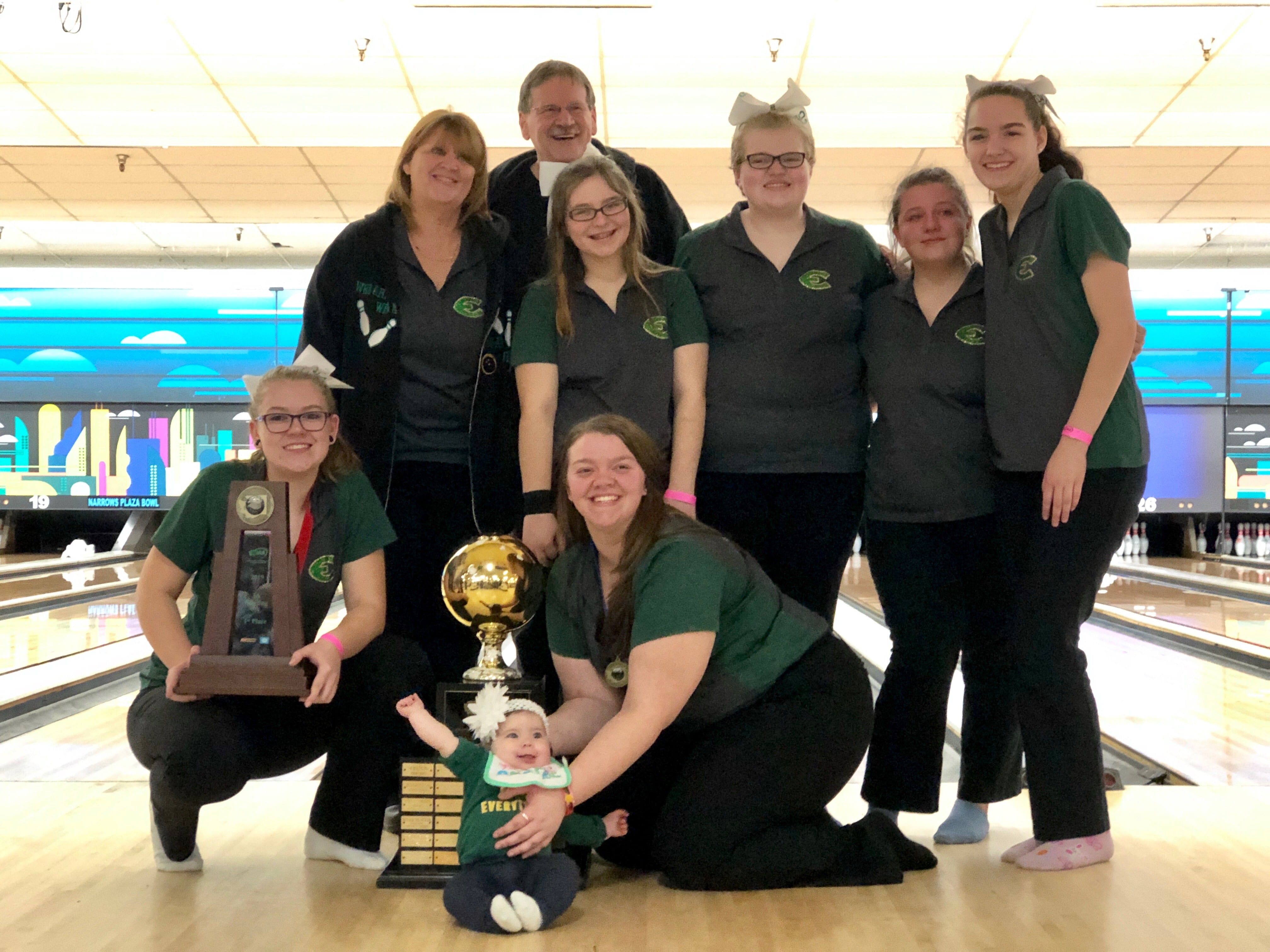 The Evergreen girls bowling team poses with the 3A state trophy at Narrows Plaza in University Place after coming in first for the third straight year.
