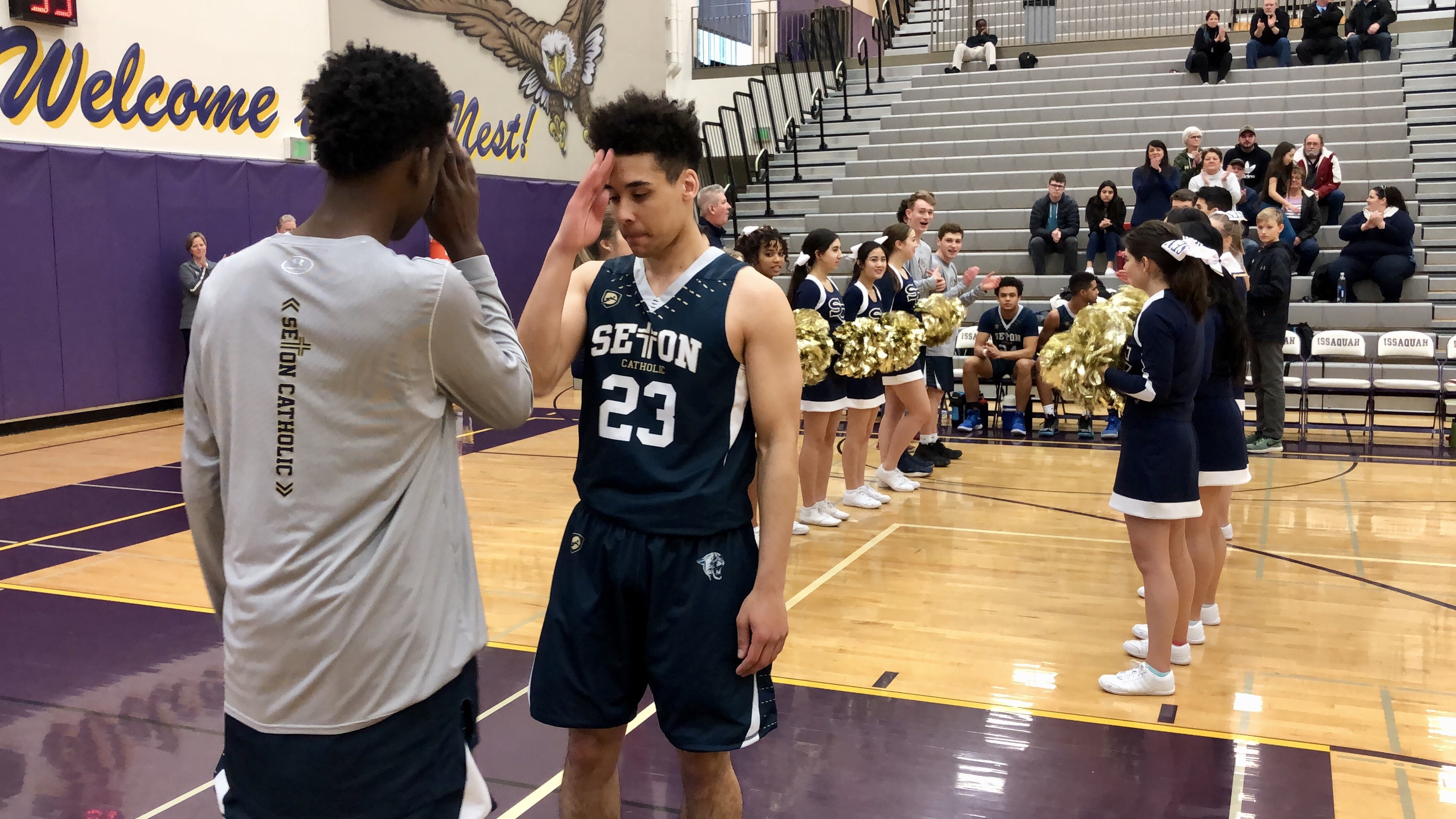 Seton Catholic's Gabe Anderson and Malik Williams coordinate a handshake during the starting lineup introductions before a 58-48 loss to Bellevue Christian on Saturday.