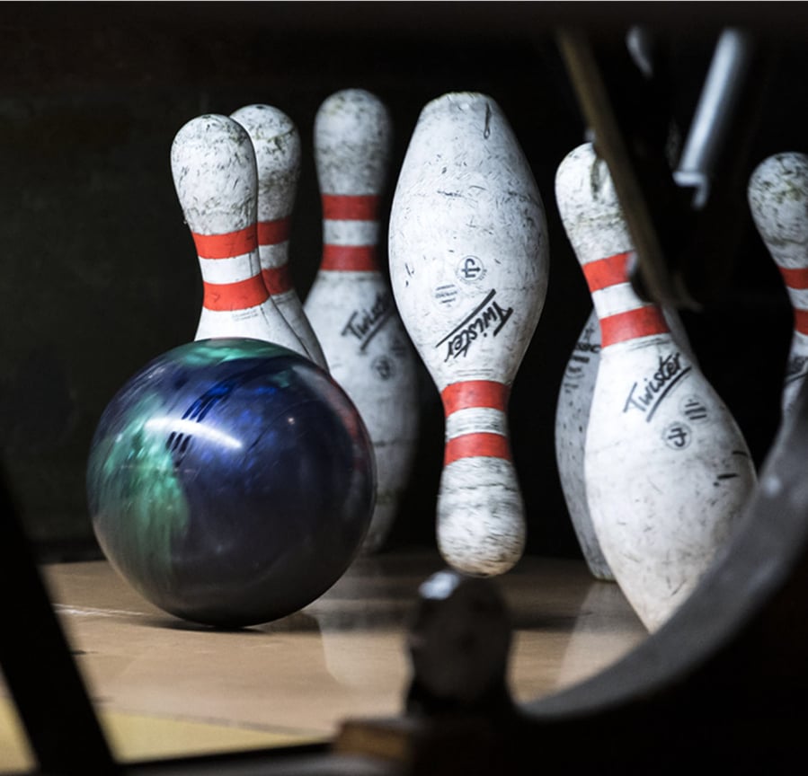 Bowling pins taking a tumble at Allen's Crosley Lanes.