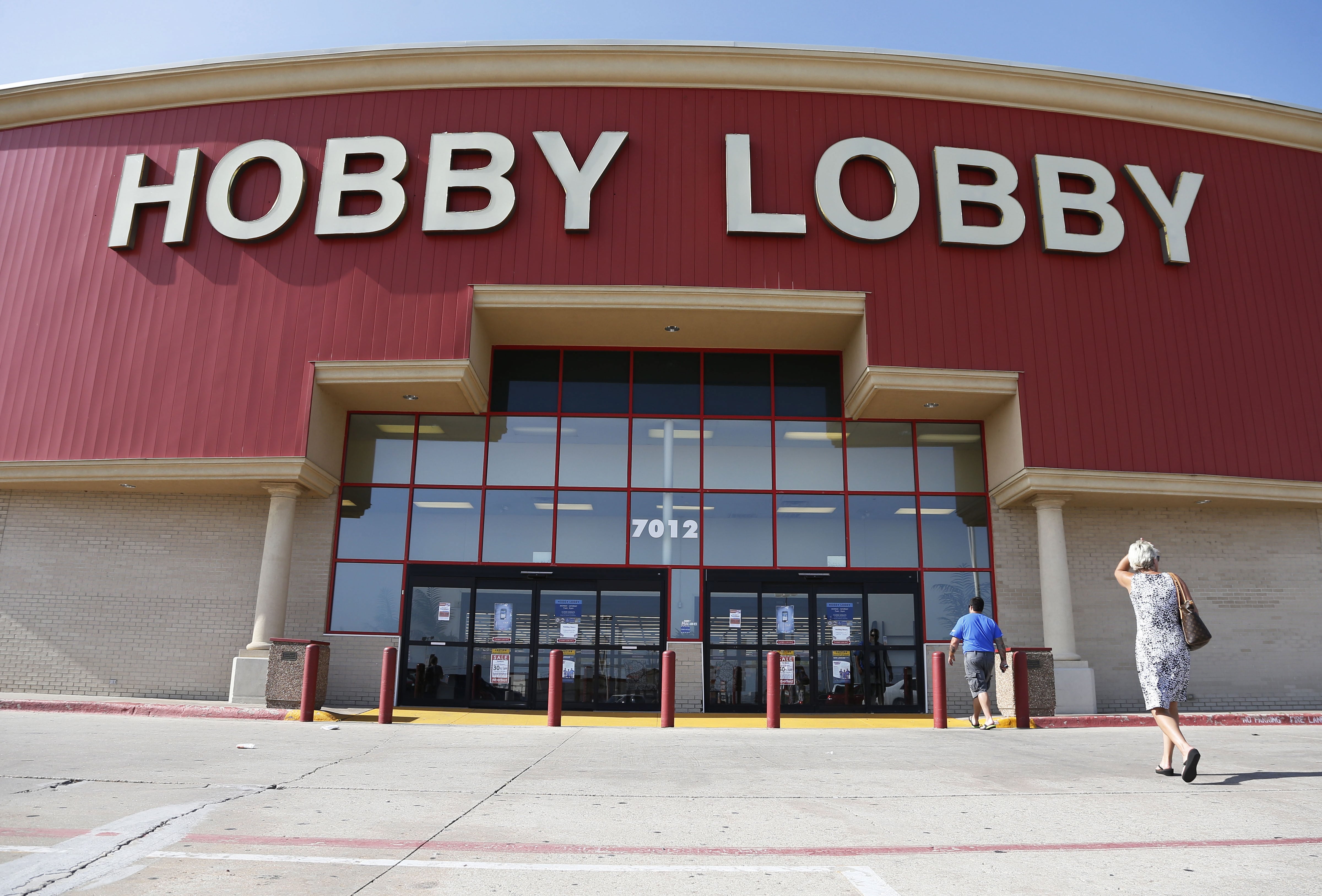 Customers walk to a Hobby Lobby store in Oklahoma City in 2014.