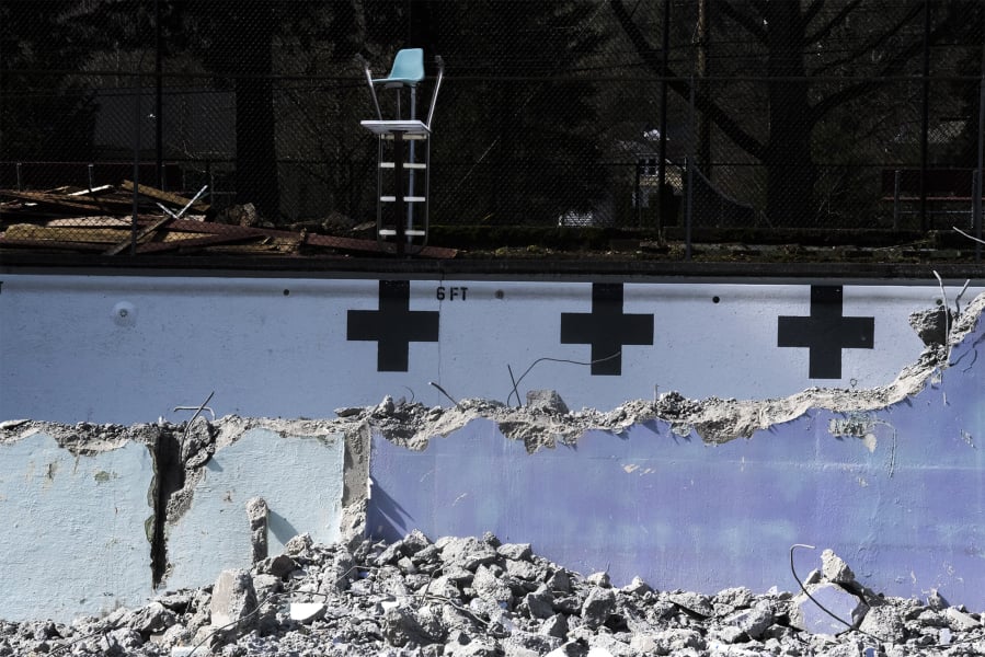 An old lifeguard chair is seen here inside the partially demolished Crown Park pool in Camas on Thursday afternoon. Demolition started this week on the pool, which opened in 1954 but hasn’t been in use since summer 2017. The work is expected to be wrapped up by April 1.