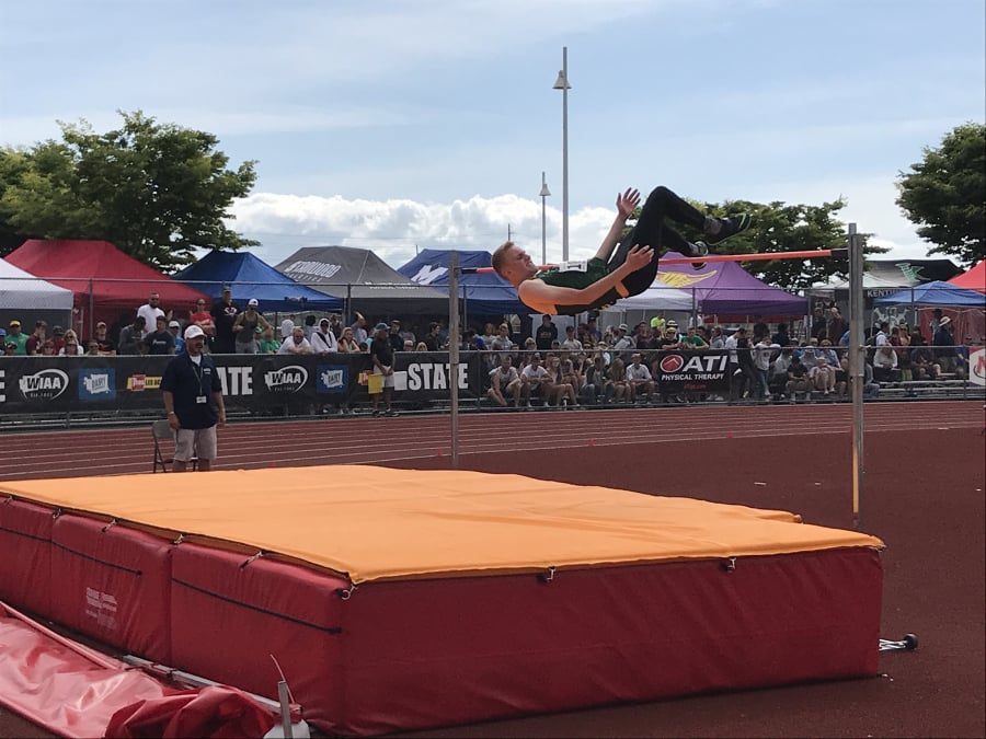 Woodland’s Alex Bishop clears the high jump bar en route to placing second at the state meet last spring in Tacoma.