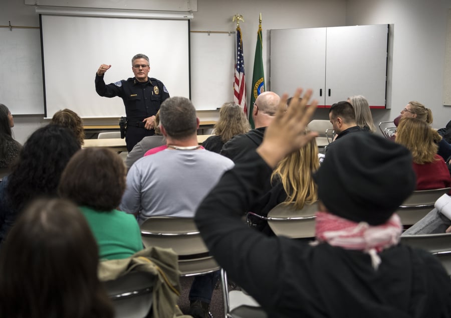Vancouver Police Chief James McElvain speaks March 13 about recent officer-involved shootings during a Vancouver Neighborhood Alliance meeting.