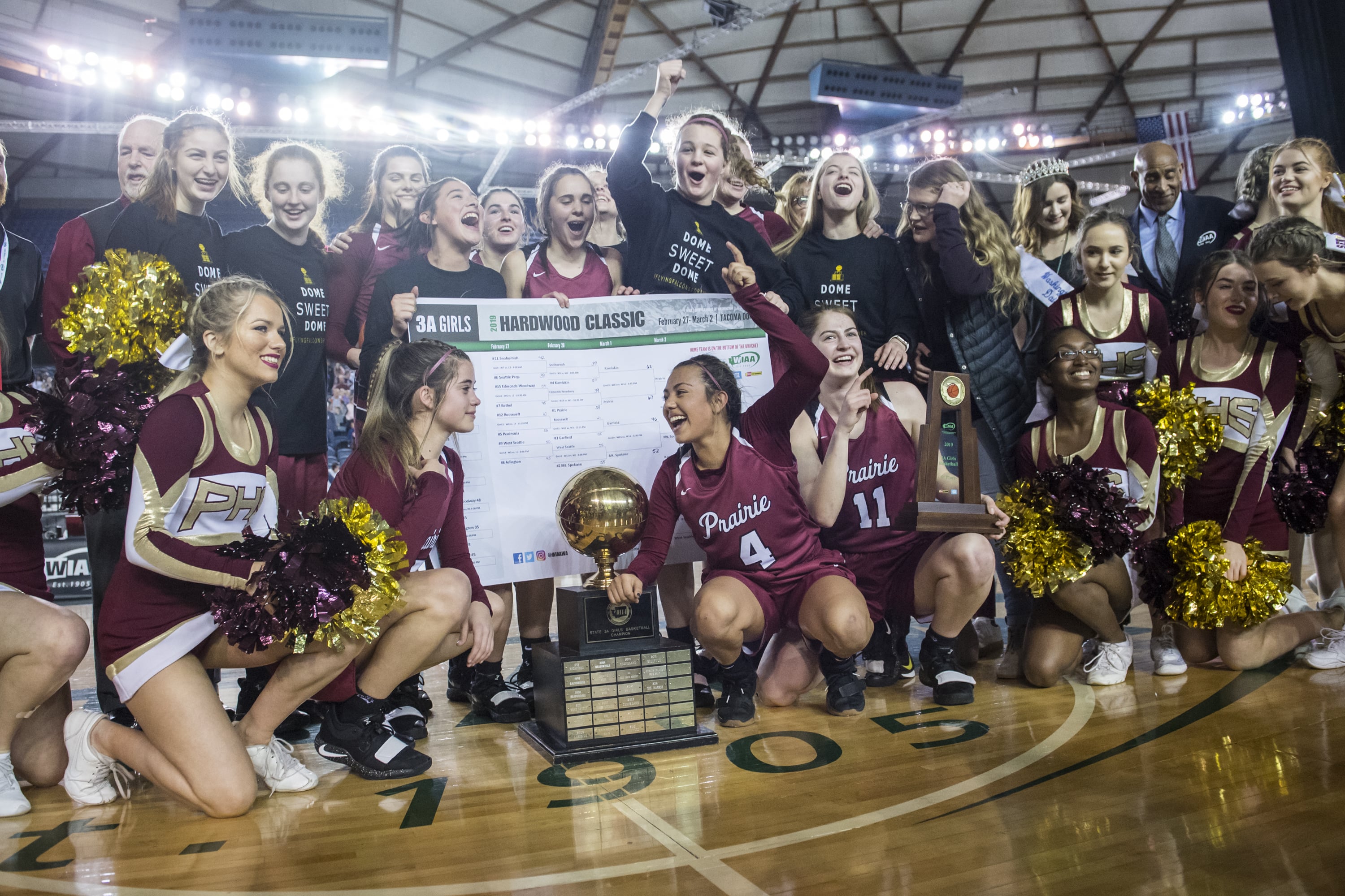 Prairie accepts their trophy following their title victory over Mt. Spokane during the 3A Hardwood Classic at the Tacoma Dome on Saturday March 2, 2019.